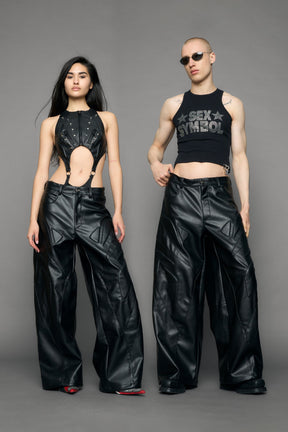 model wearing black oversize pu leather pants with moto style highlights