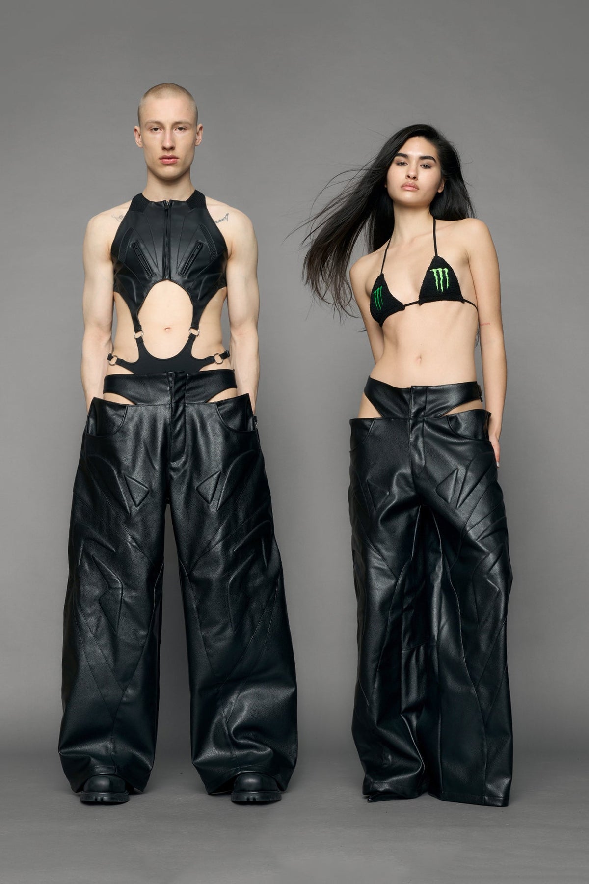 models wearing black pu leather trousers with thong design and moto style highlights
