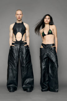 models wearing black pu leather trousers with thong design and moto style highlights