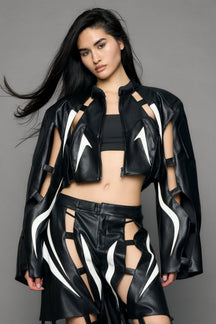 model wearing black and white moto pu leather jacket with cut out design