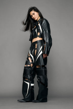 model wearing black and white moto pu leather jacket with cut out design