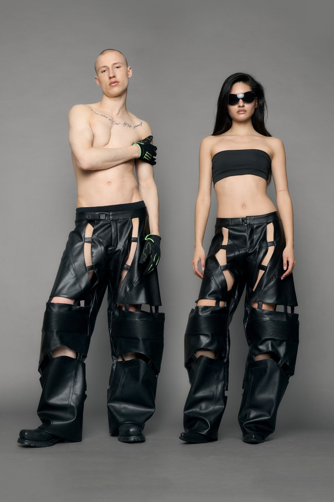 model wearing black pu leather pants with cut out details
