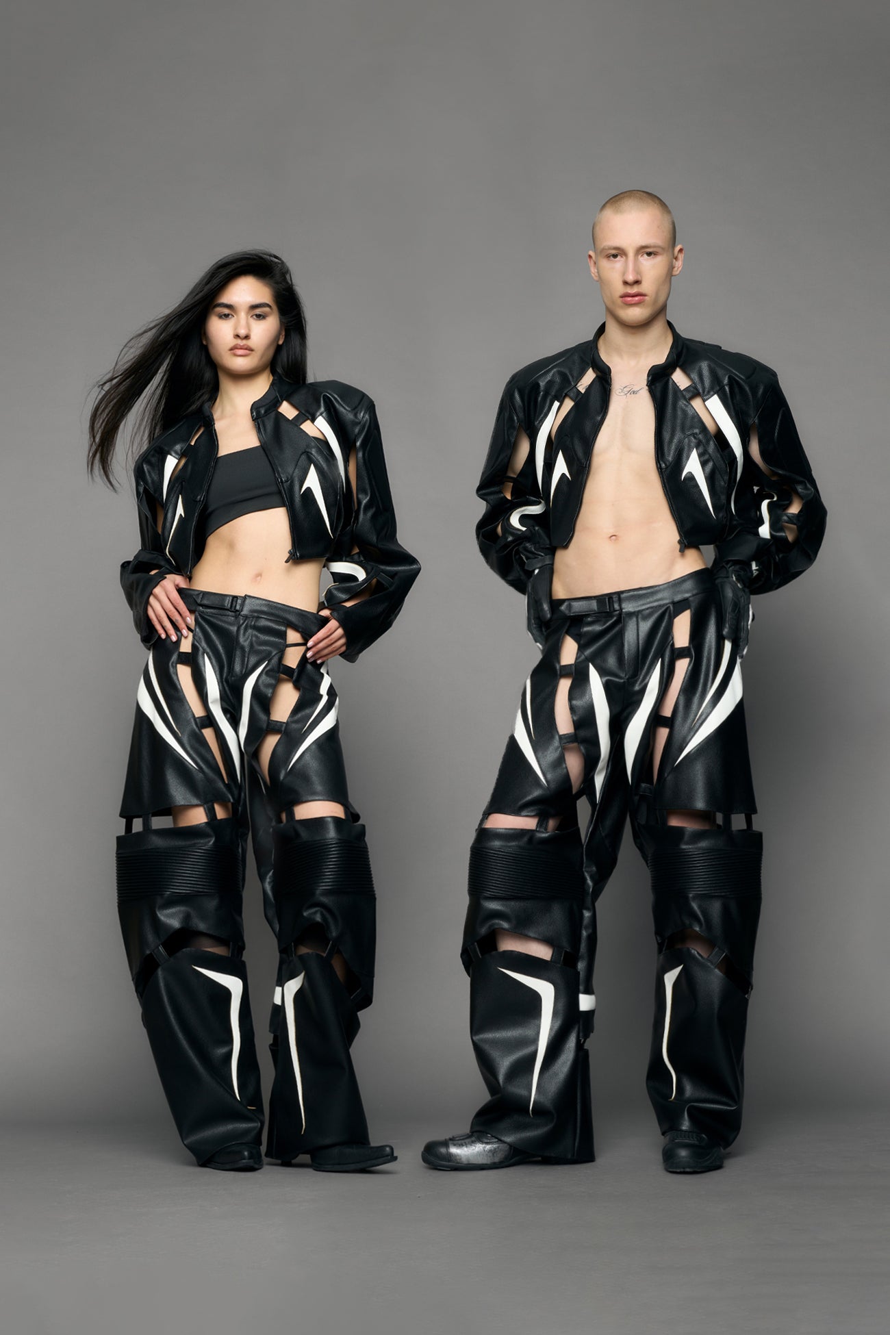 model wearing black and white moto pu leather jacket with cut out design
