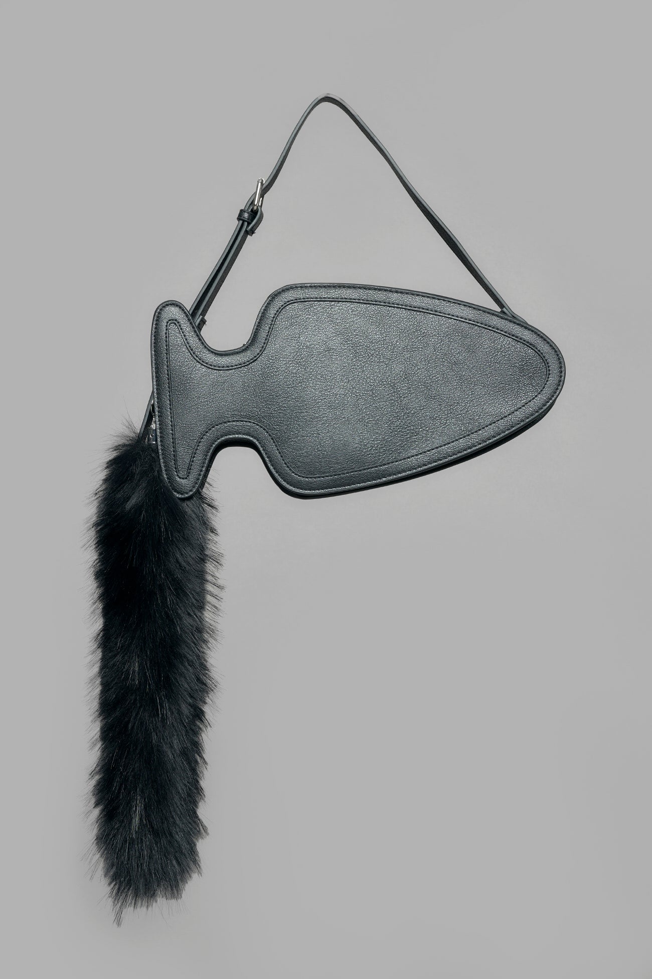 black butt plug bag with adjustable strap and faux fur detail worn as shoulder bag studio ecommerce image