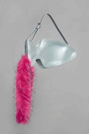 silver butt plug bag with adjustable strap and faux fur detail worn as shoulder bag studio ecommerce image