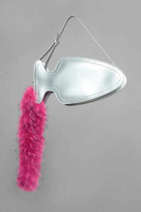 silver butt plug bag with adjustable strap and faux fur detail worn as shoulder bag studio ecommerce image