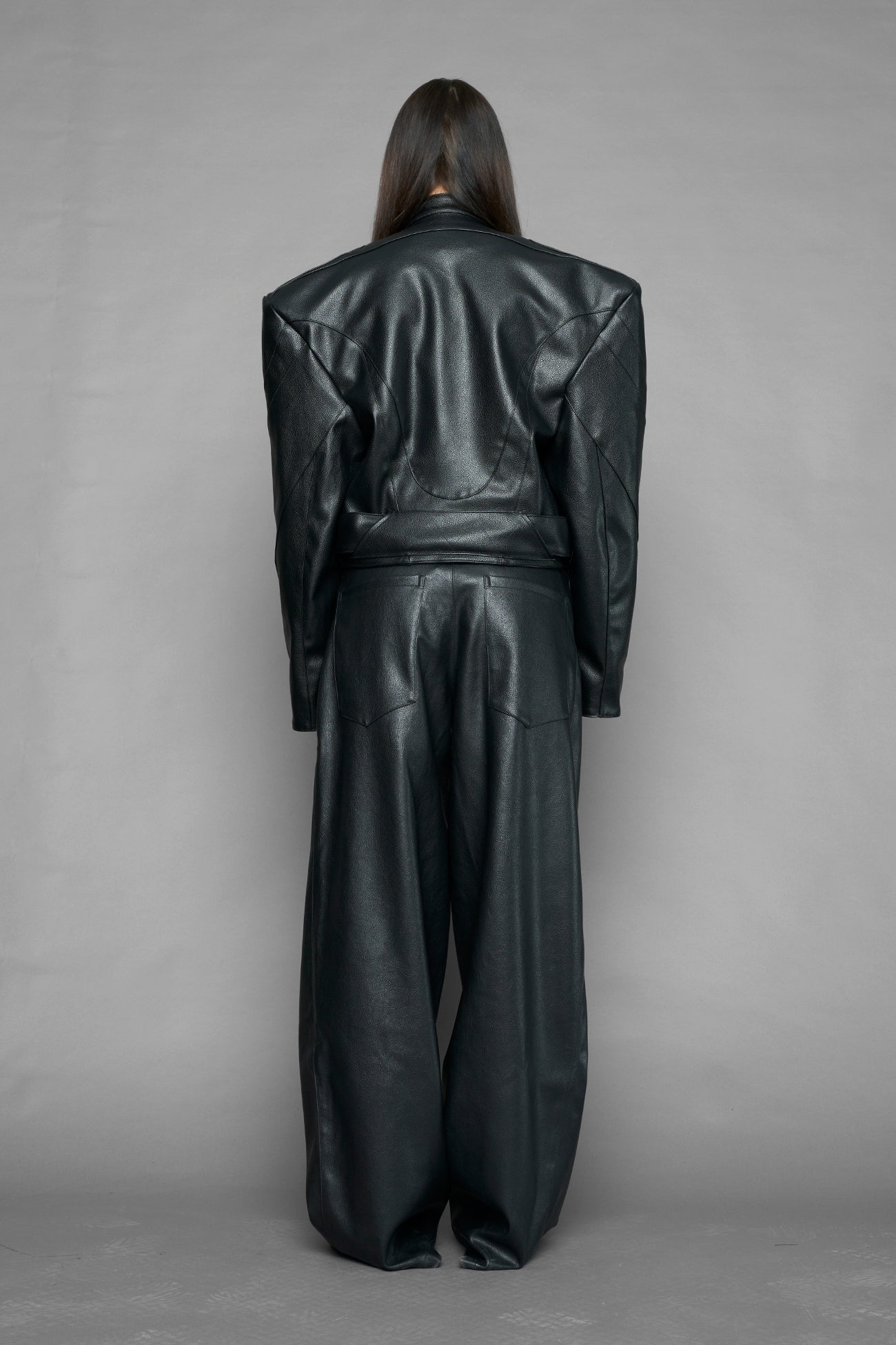 black power shoulder moto jacket with extreme sculpted shoulders and integrated boning construction worn by models studio ecommerce image