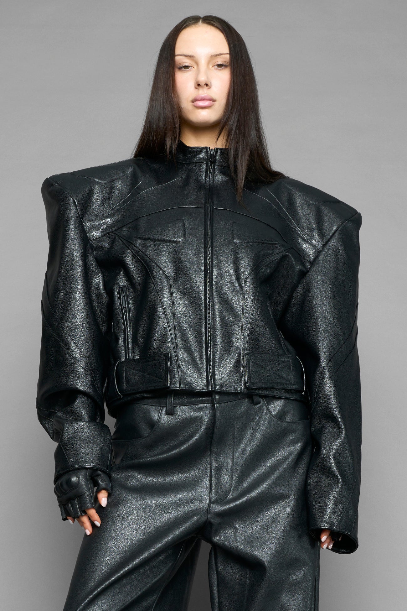 black power shoulder moto jacket with extreme sculpted shoulders and integrated boning construction worn by models studio ecommerce image