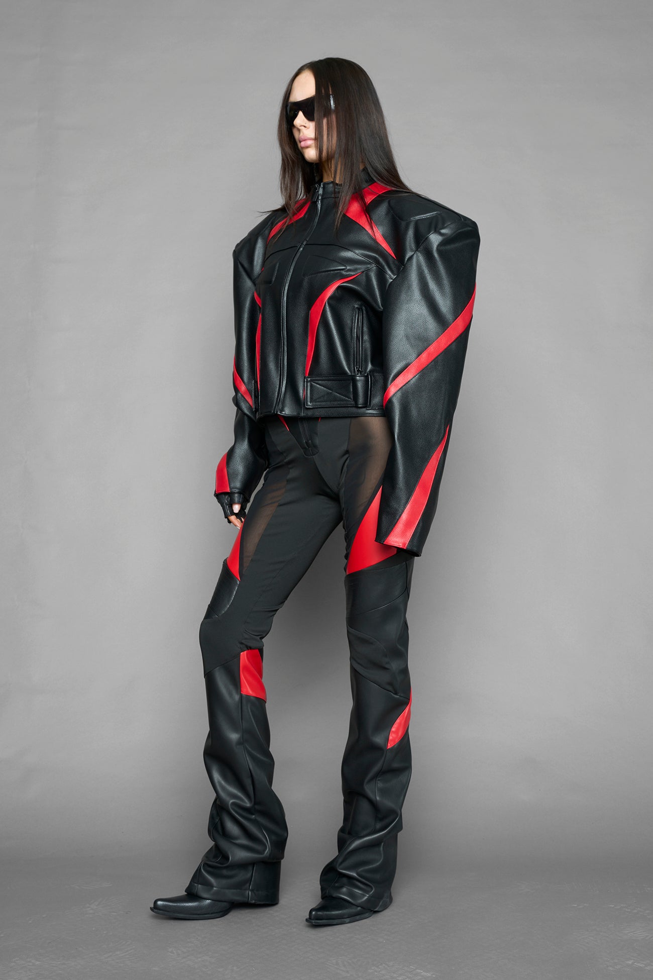 black red power shoulder moto jacket with extreme sculpted shoulders and integrated boning construction worn by models studio ecommerce image