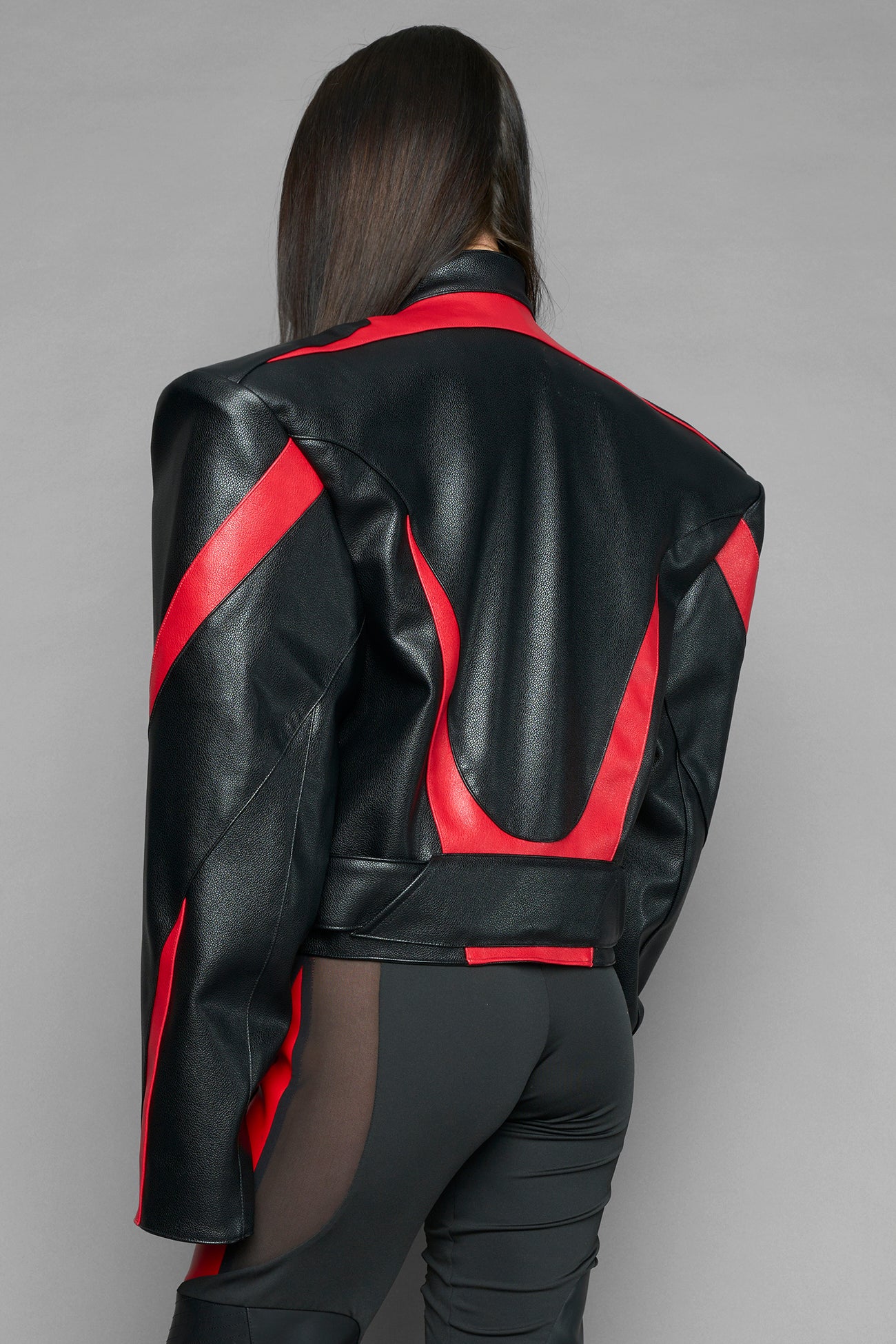 black red power shoulder moto jacket with extreme sculpted shoulders and integrated boning construction worn by models studio ecommerce image