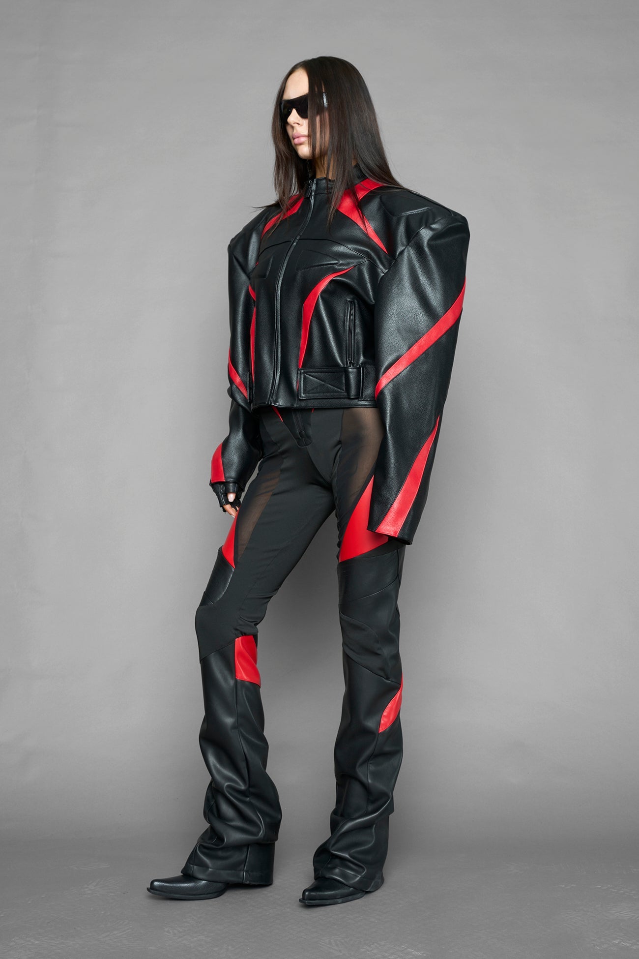 black red power shoulder moto jacket with extreme sculpted shoulders and integrated boning construction worn by models studio ecommerce image