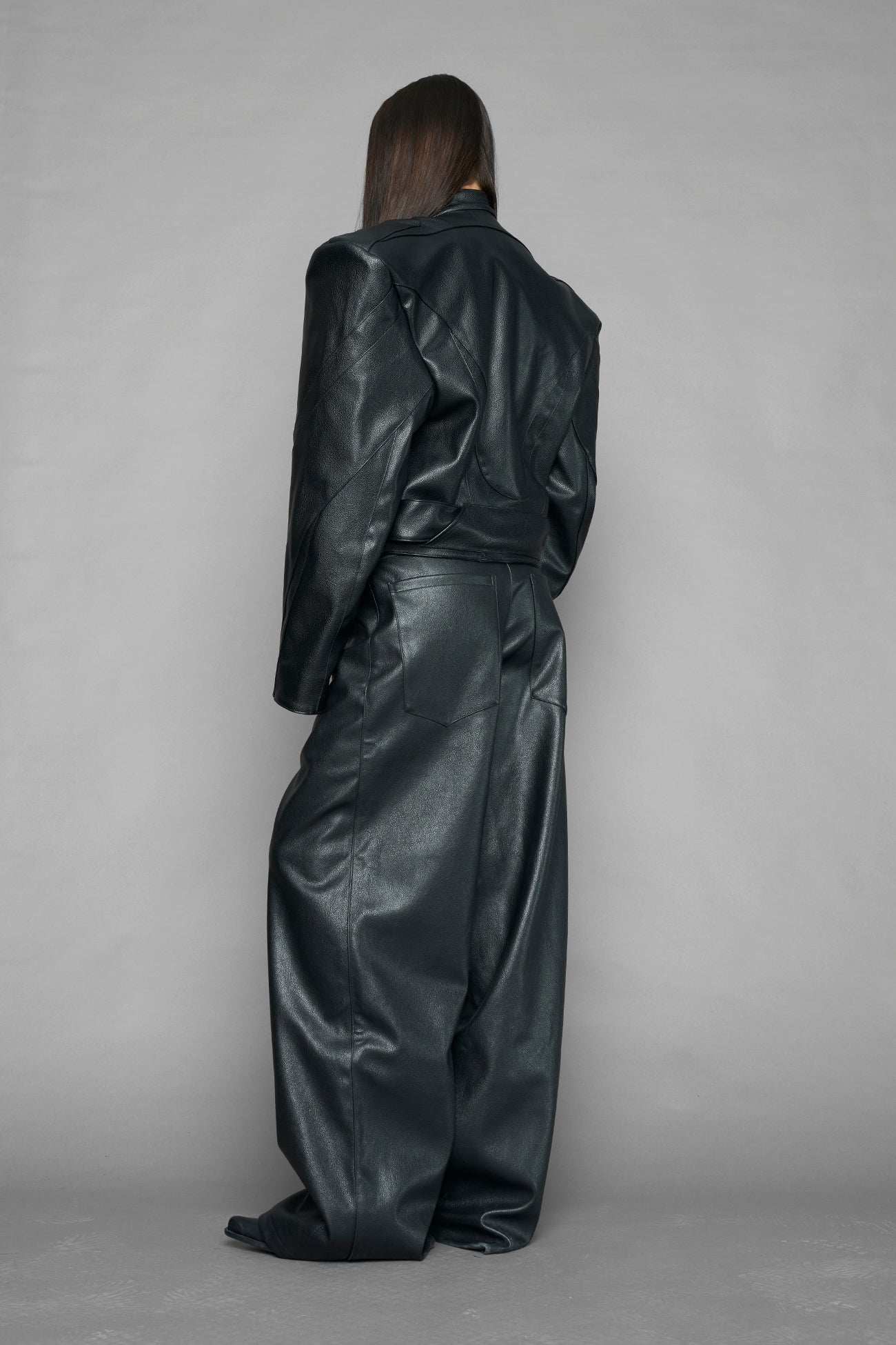 black power shoulder moto jacket with extreme sculpted shoulders and integrated boning construction worn by models studio ecommerce image
