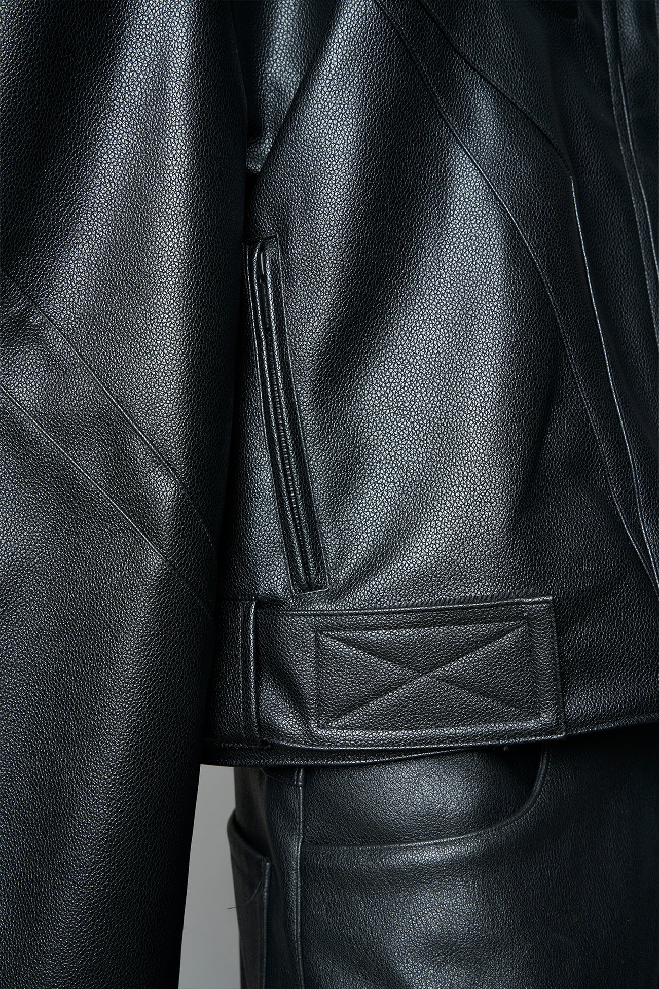 black power shoulder moto jacket with extreme sculpted shoulders and integrated boning construction worn by models studio ecommerce image