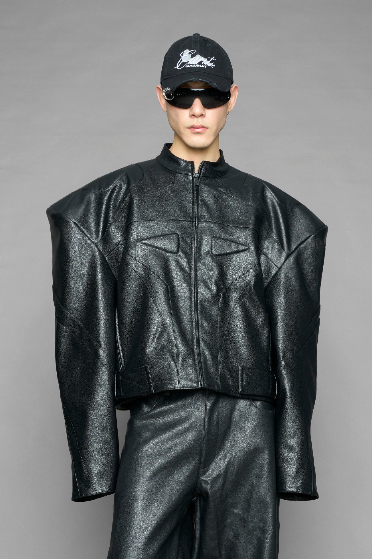 black power shoulder moto jacket with extreme sculpted shoulders and integrated boning construction worn by models studio ecommerce image