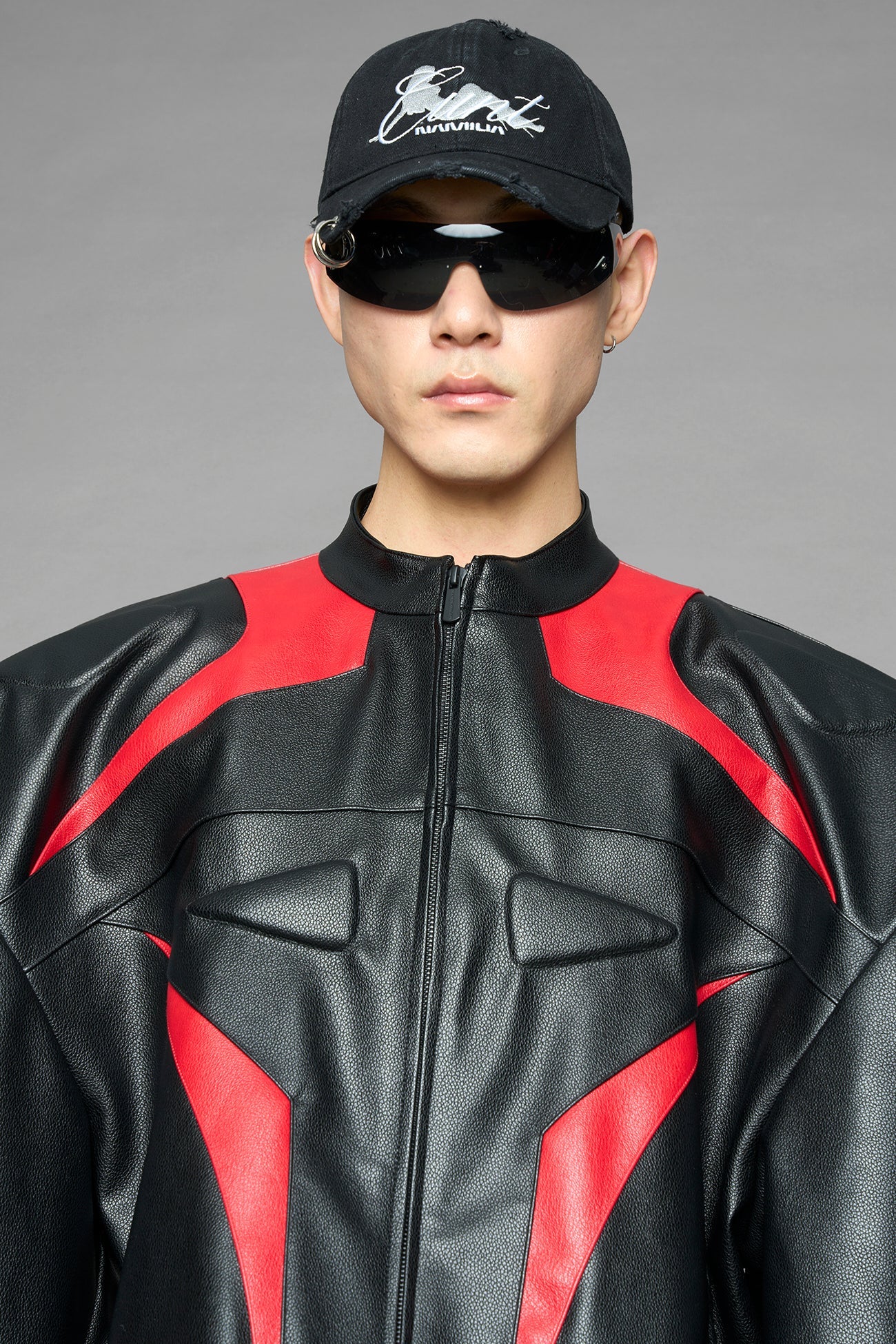 black red power shoulder moto jacket with extreme sculpted shoulders and integrated boning construction worn by models studio ecommerce image