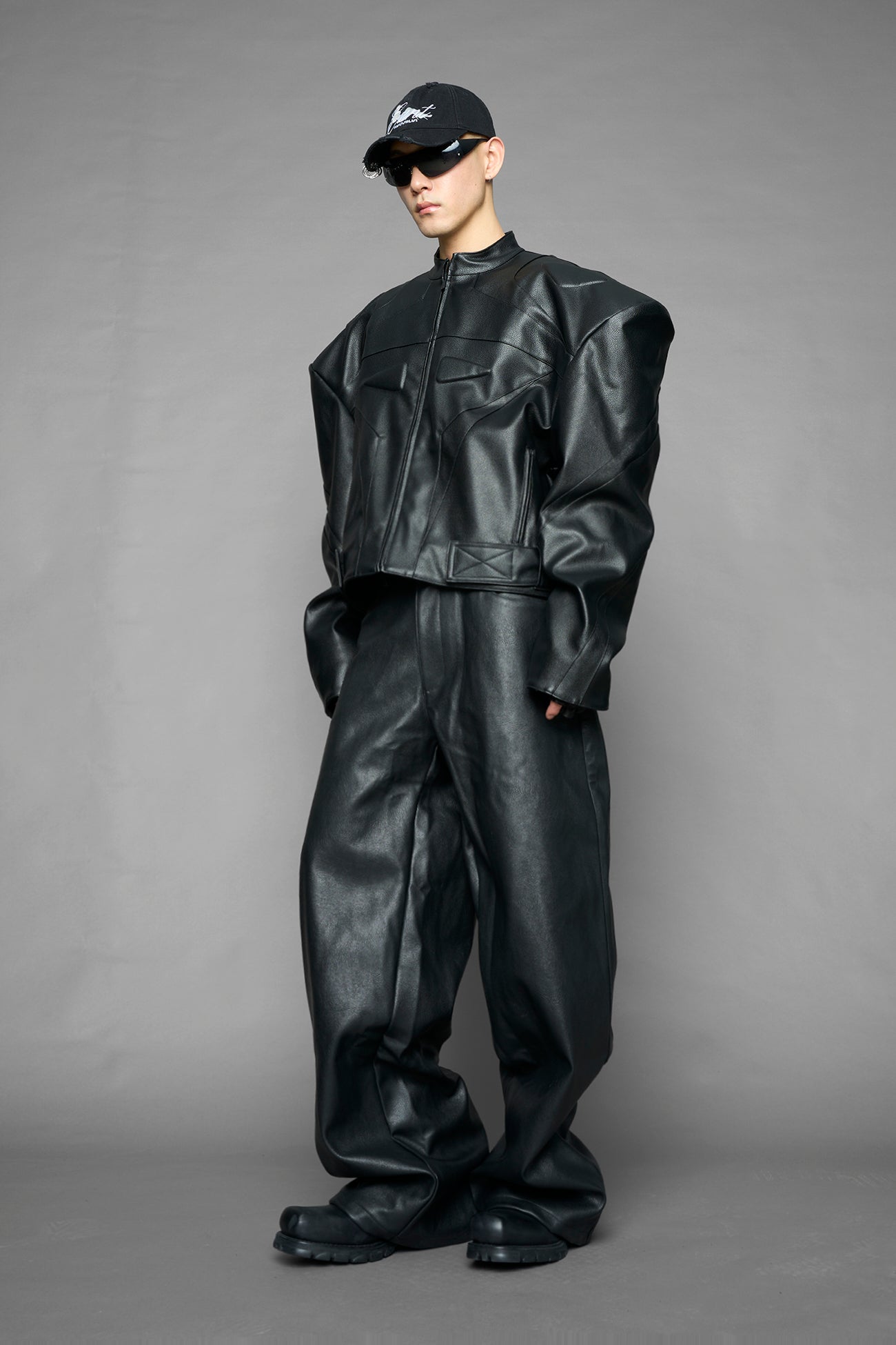 black power shoulder moto jacket with extreme sculpted shoulders and integrated boning construction worn by models studio ecommerce image