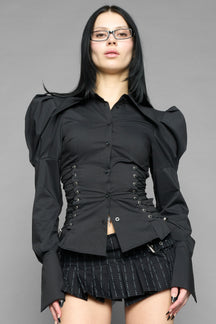 black puff shoulder blouse with corset lace up sides and button front worn by model studio ecommerce image