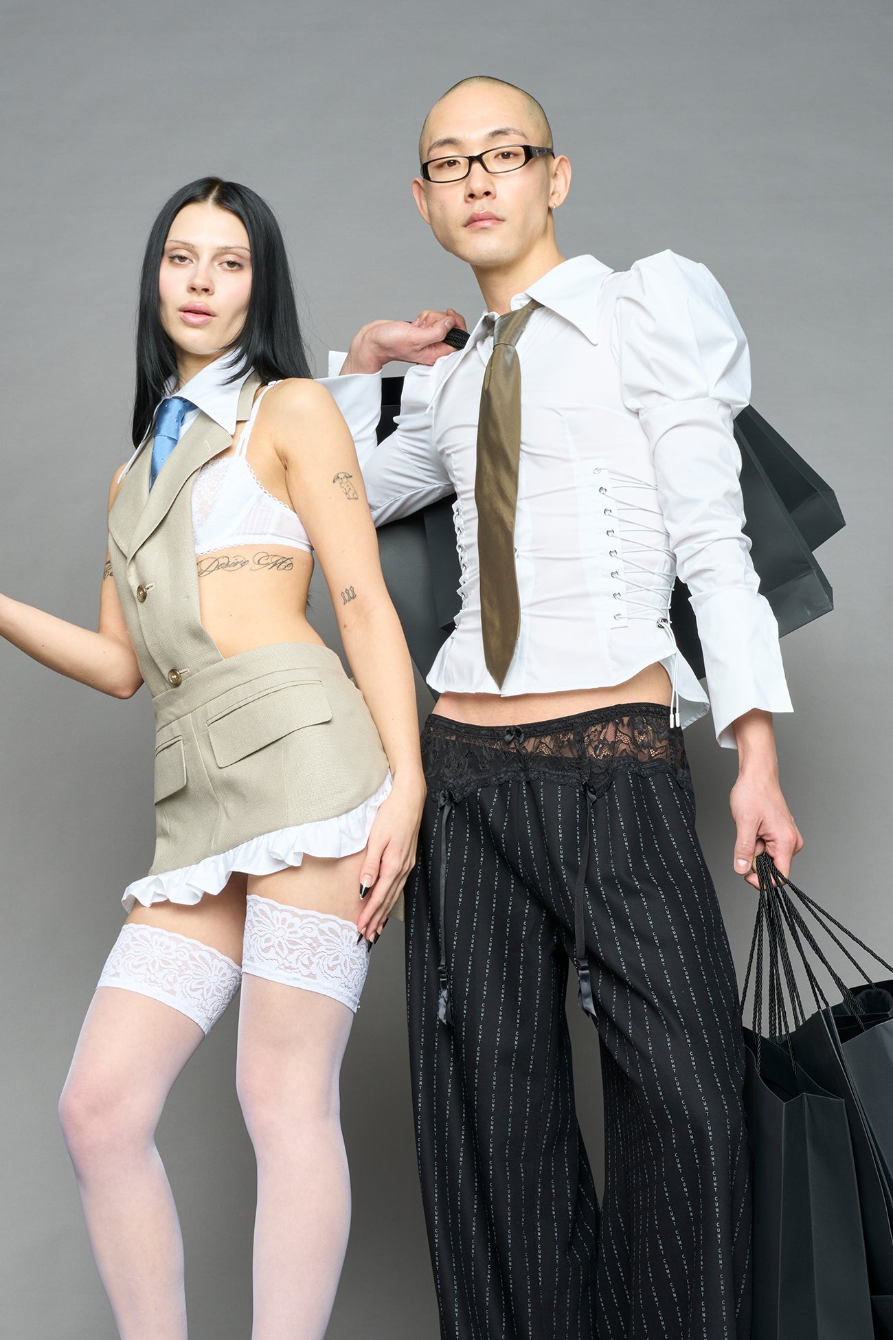 white puff shoulder blouse with corset lace up sides and button front worn by model studio ecommerce image