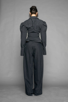 black print puff shoulder blouse with corset lace up sides and button front worn by model studio ecommerce image