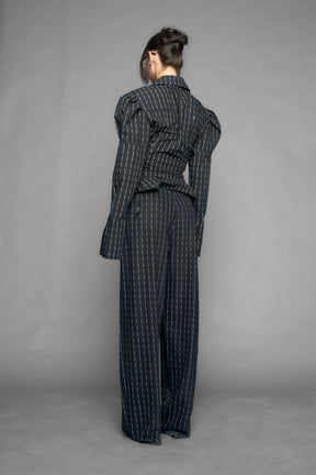 black print puff shoulder blouse with corset lace up sides and button front worn by model studio ecommerce image