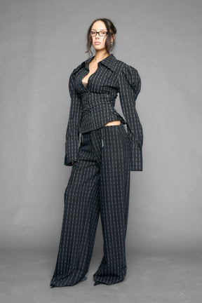 black print puff shoulder blouse with corset lace up sides and button front worn by model studio ecommerce image