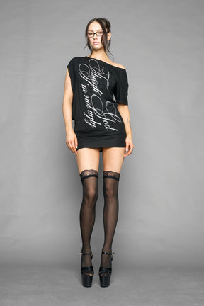 black off shoulder mini dress with oversized script text print and short sleeves worn by model studio ecommerce image