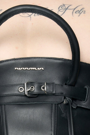 model wearing black pu leahter corset with handbag design 