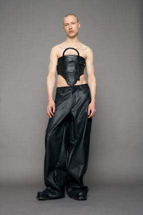 model wearing black pu leahter corset with handbag design 