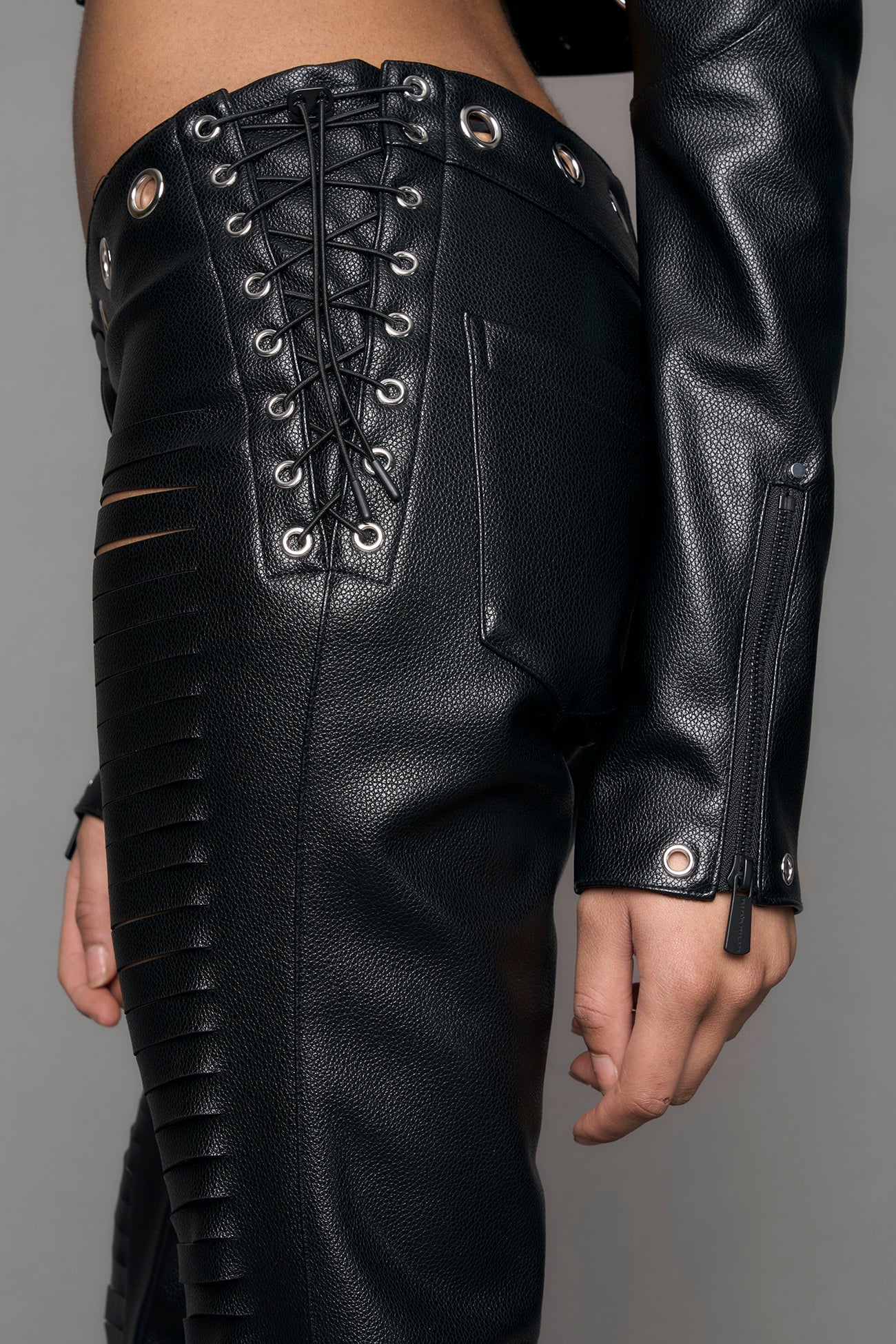 black vegan leather pants with cuts