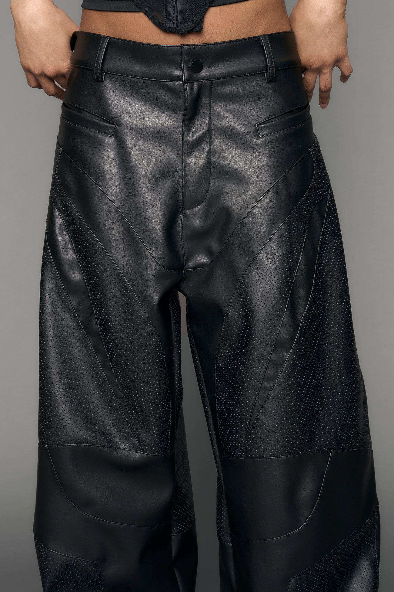 model wearing black vegan moto inspired baggy pants