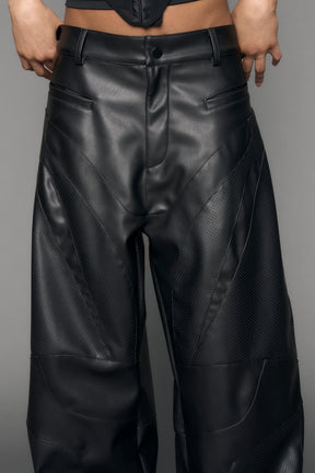 model wearing black vegan moto inspired baggy pants