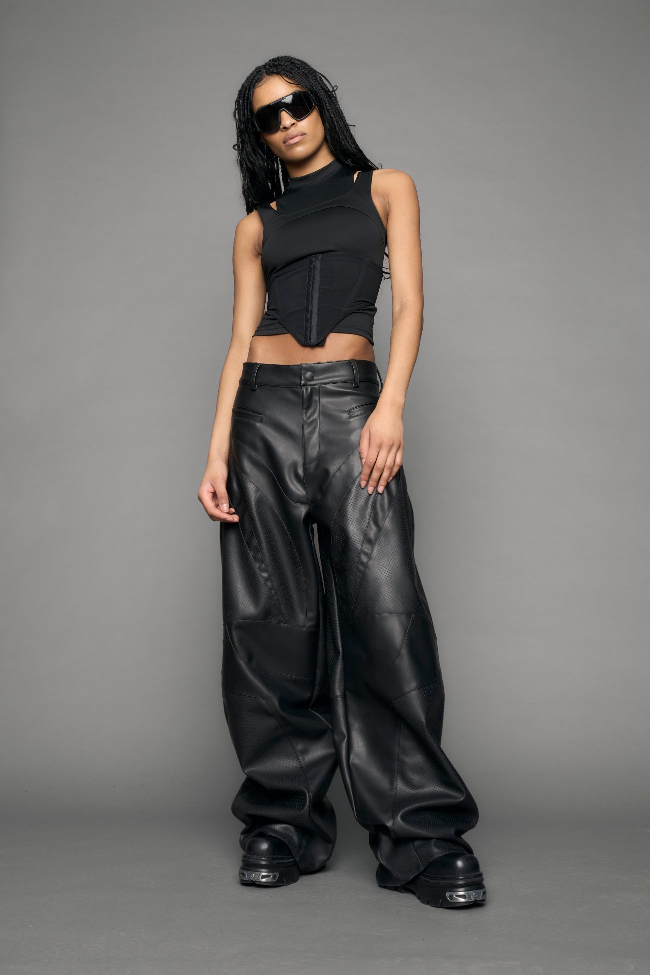 model wearing black vegan moto inspired baggy pants