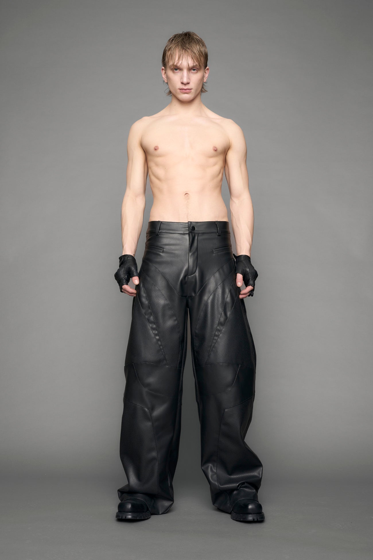 model wearing black vegan moto inspired baggy pants