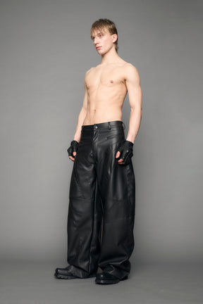 model wearing black vegan moto inspired baggy pants