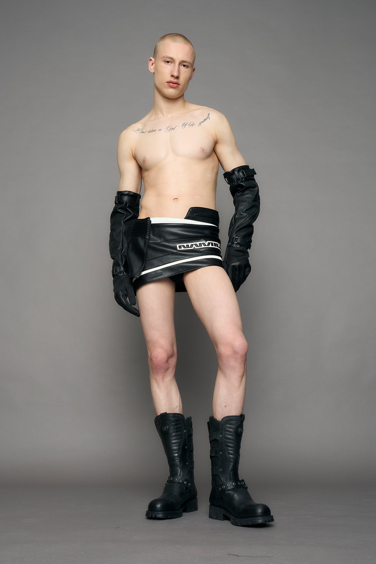 model wearing black and white moto mini skirt with logo detail