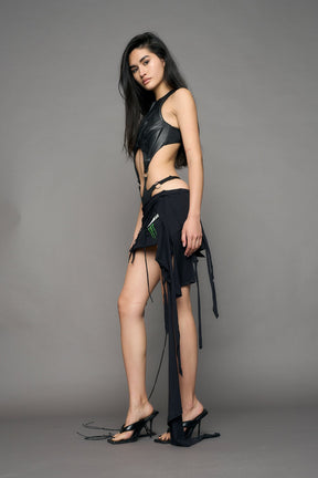model wearing black pu leather body with flat panty and moto style lines