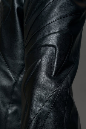 model wearing black pu leather trousers with thong design and moto style highlights