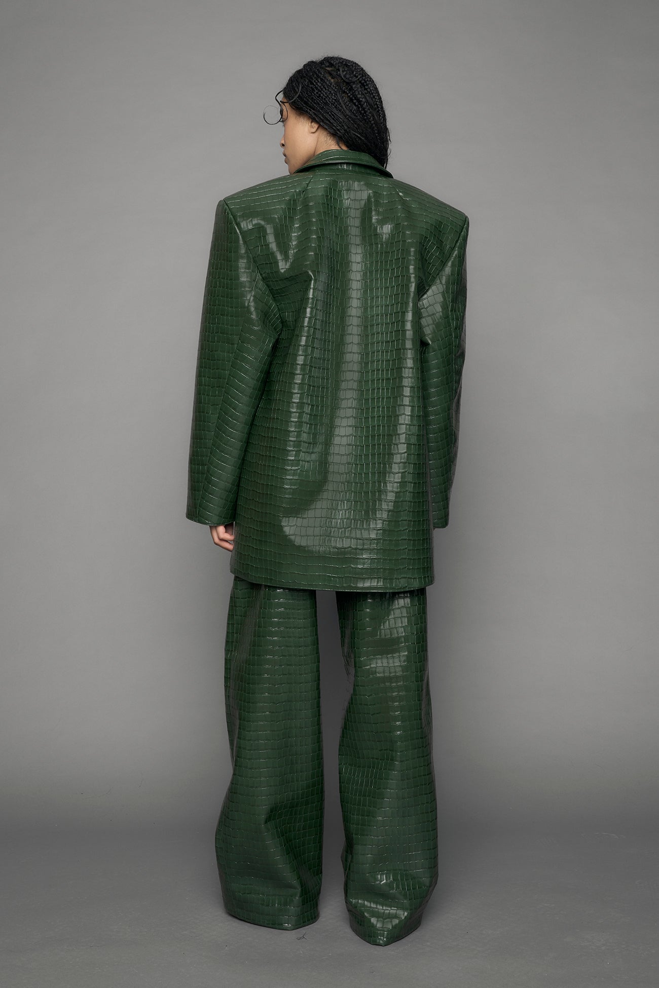 model wearing green vegan leather croc blazer