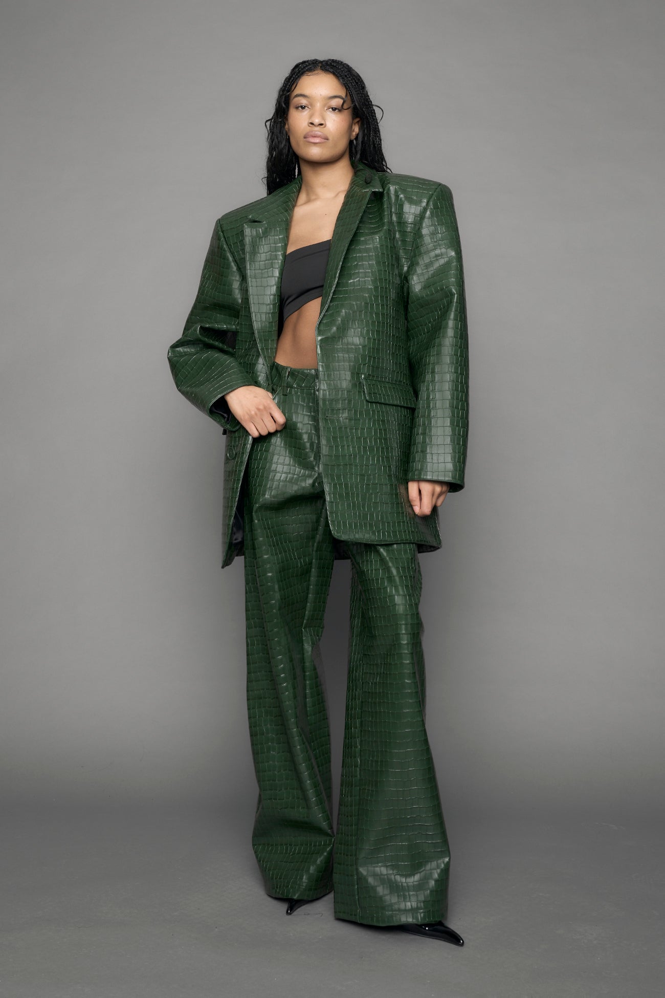 model wearing green vegan leather croc blazer