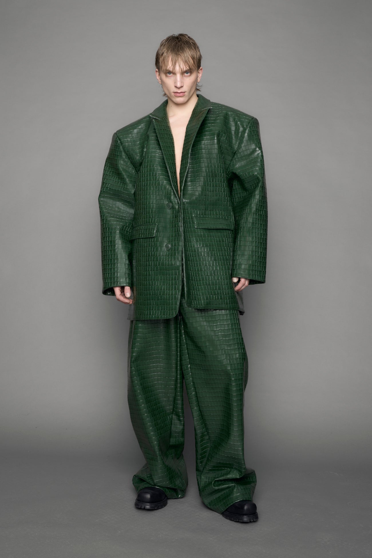 model wearing green vegan leather croc blazer
