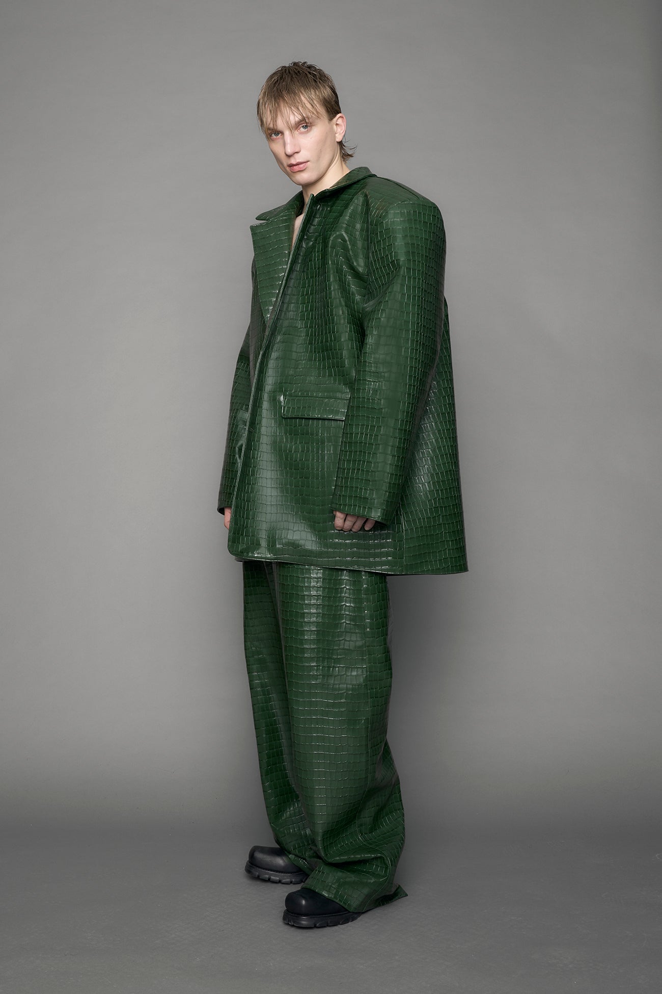 model wearing green vegan leather croc blazer