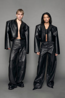 model wearing black vegan leather blazer cropped