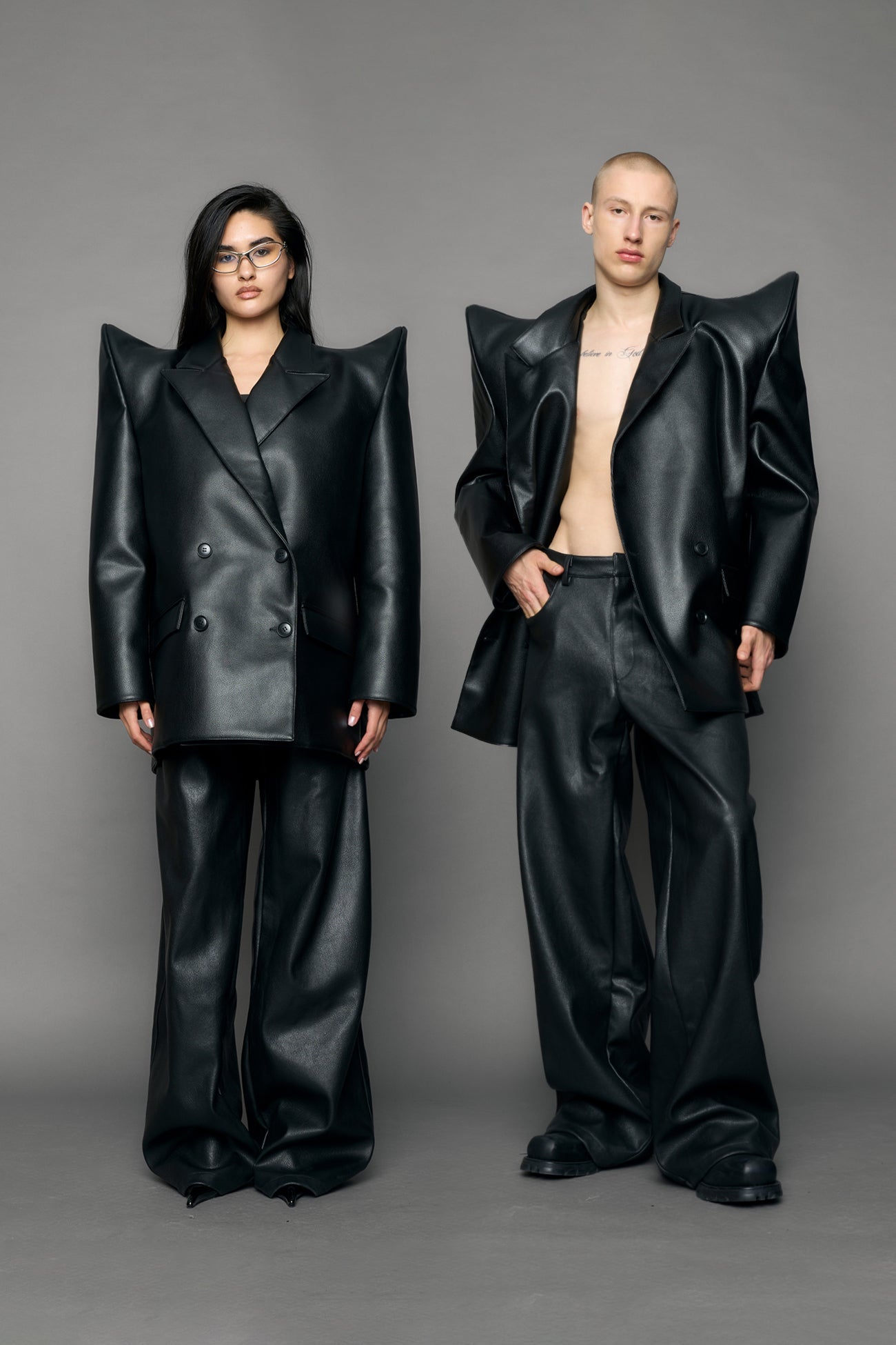 model wearing black pu leather blazer with sharp shoulder design