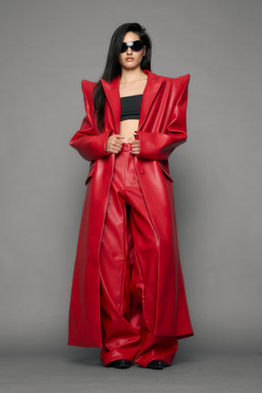 model wearing red pu leather coat with sharp shoulder design