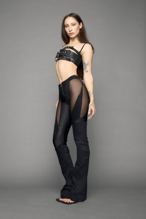 model wearing black denim moto mesh pants