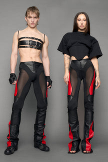 model wearing black red moto mesh pants