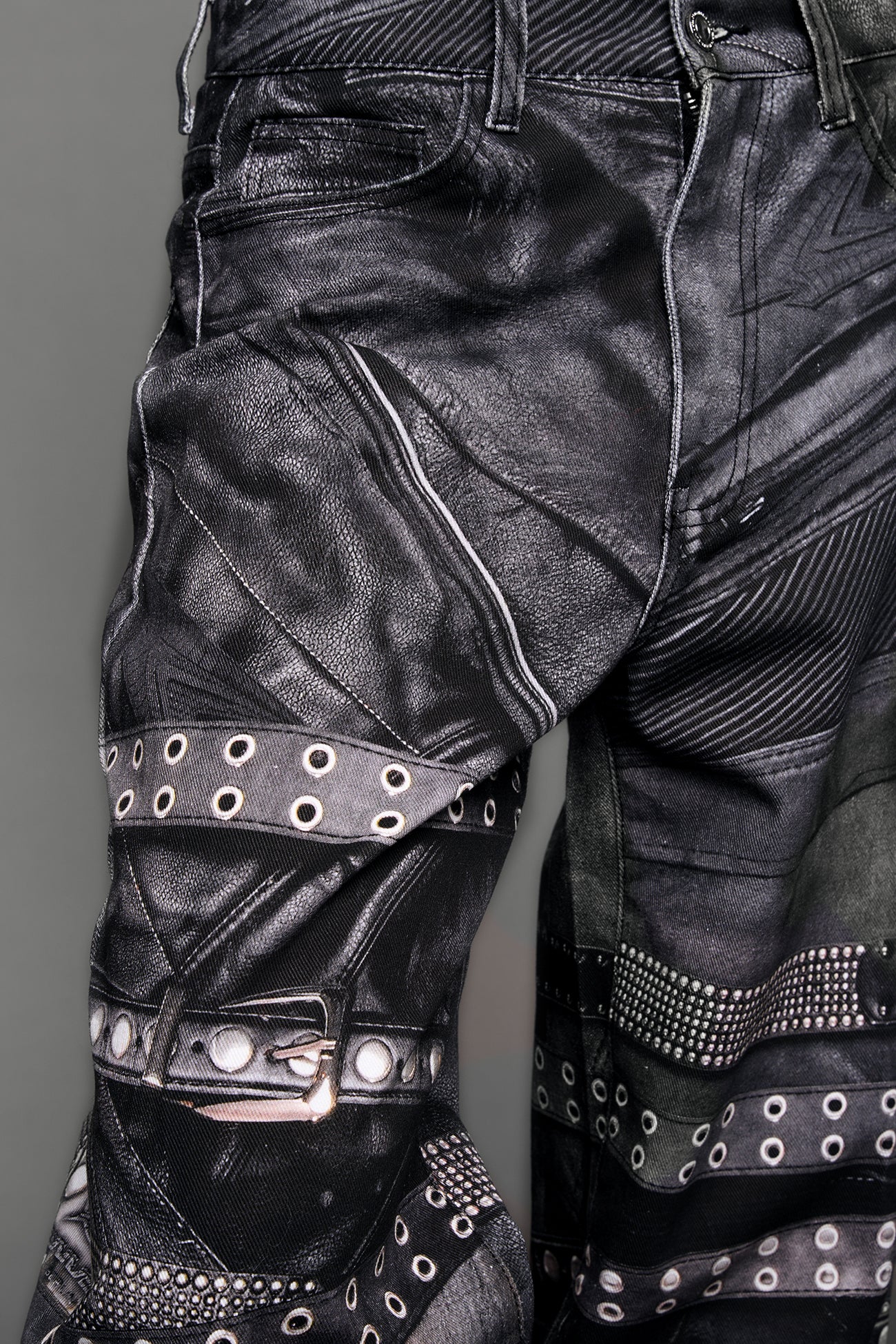 model wearing black printed motocross denim pants