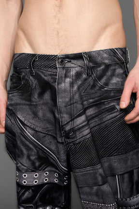 model wearing black printed motocross denim pants