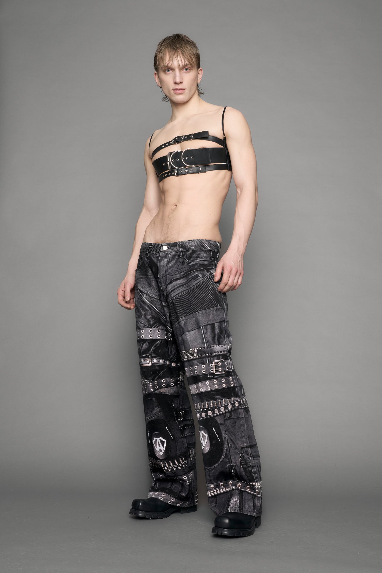 model wearing black printed motocross denim pants