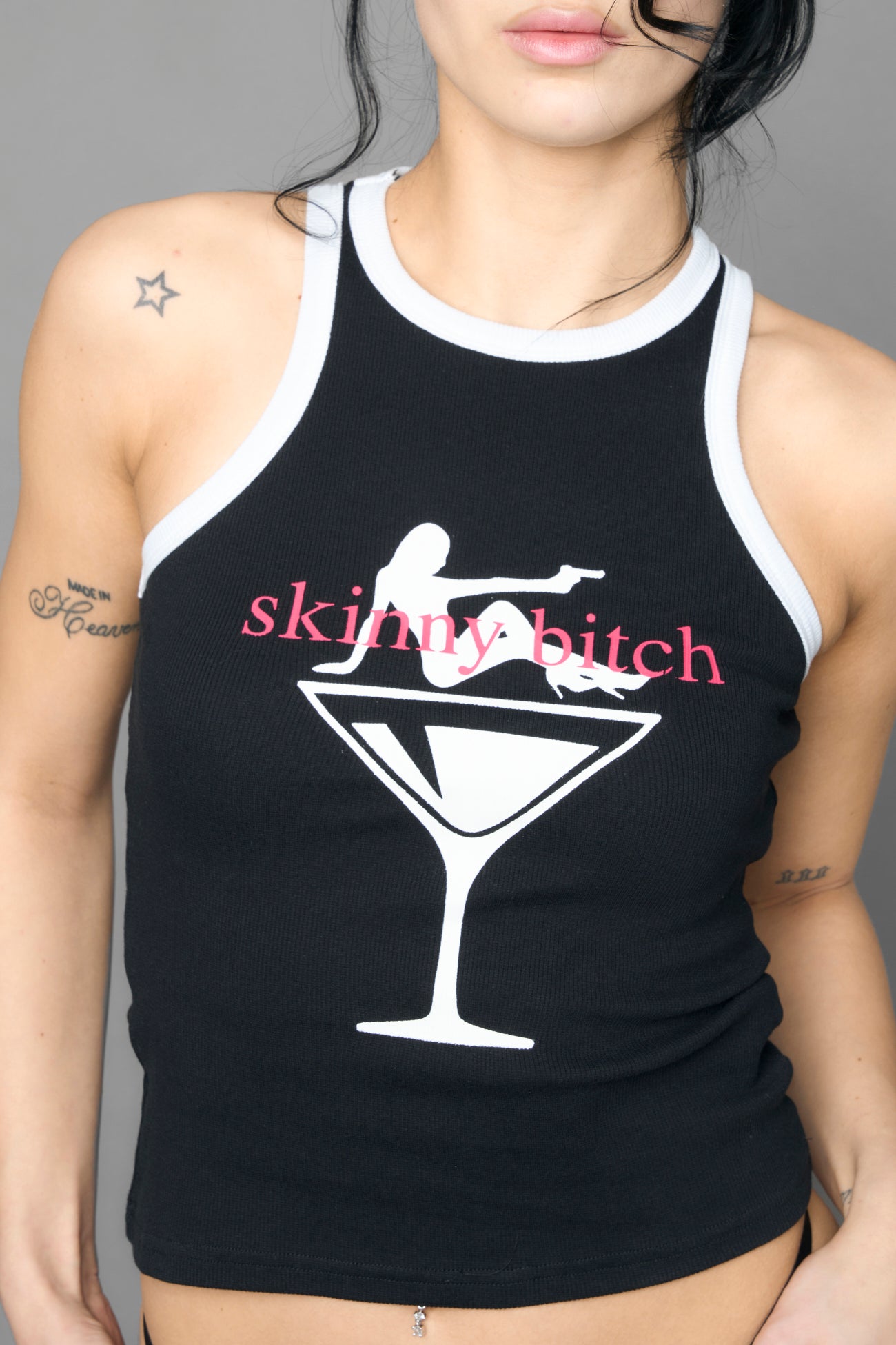 Black tank top with graphic design and text on a gray background